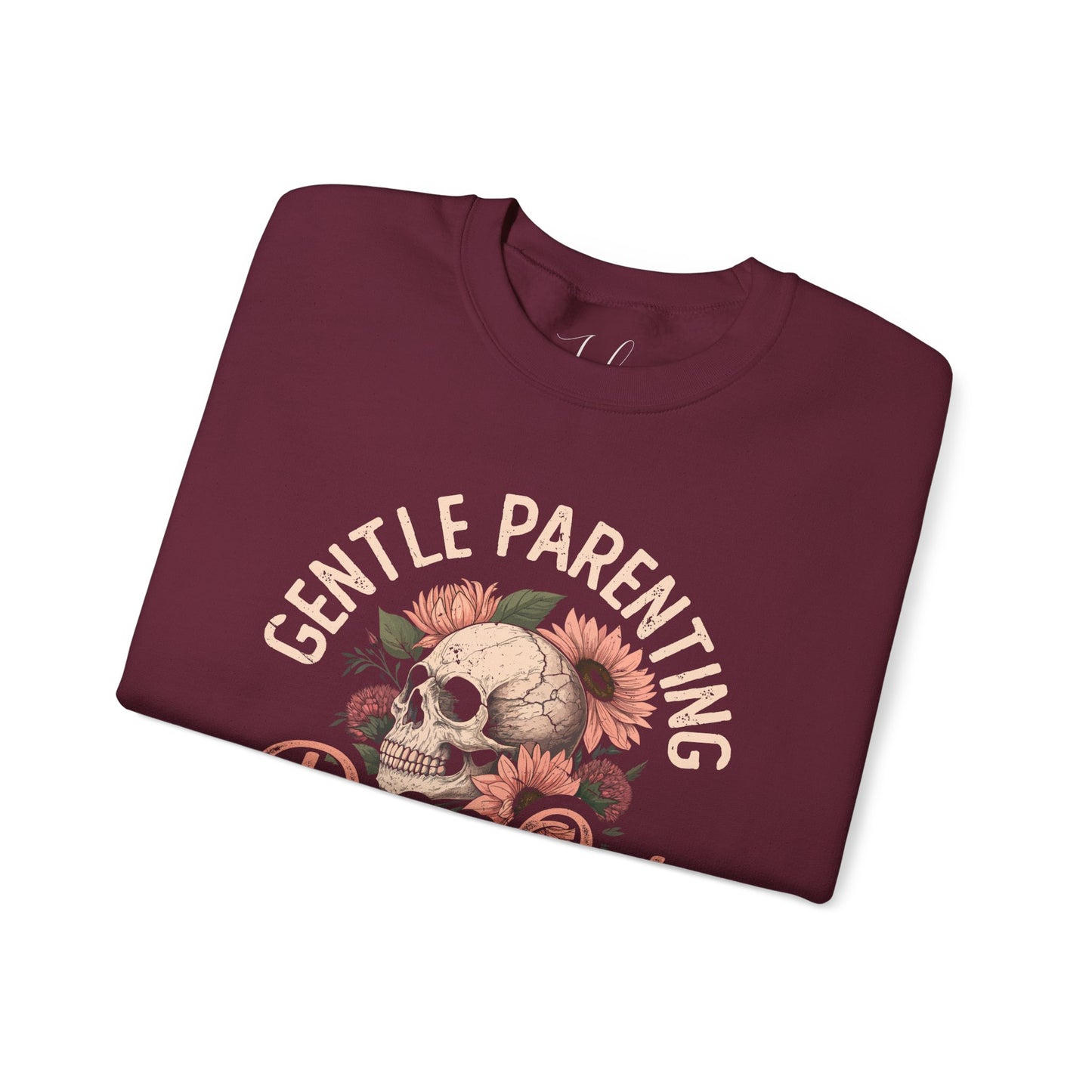 Maroon folded crewneck with floral skull and “Gentle Parenting Drop Out” print.