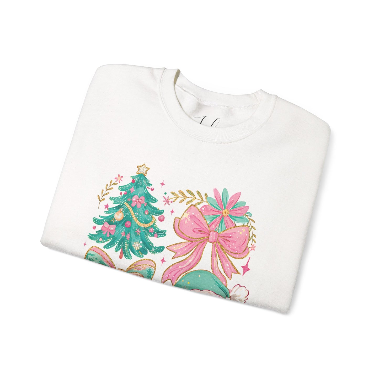 White folded crewneck sweater showing pastel floral Santa and bow Christmas tree graphic.