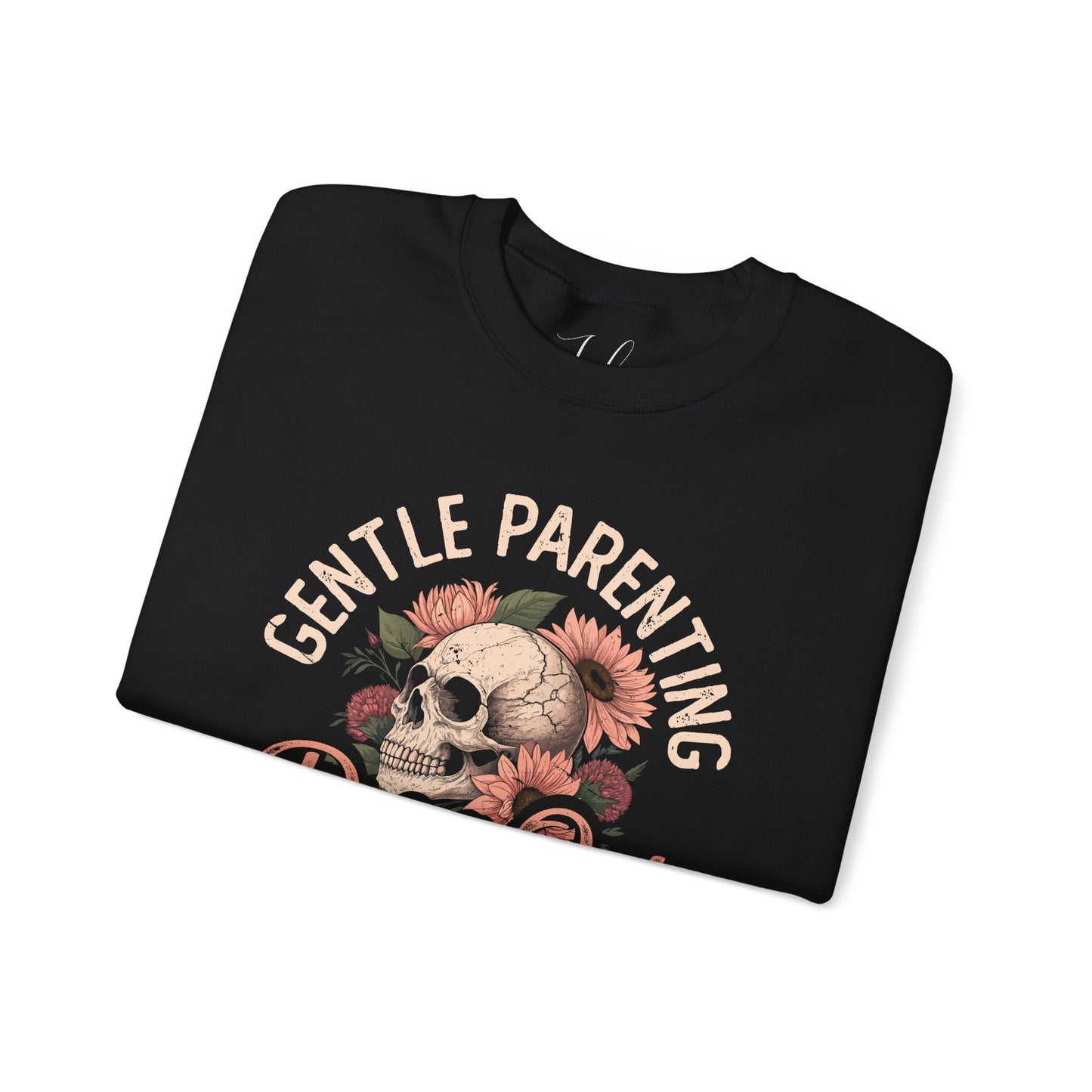 Black folded crewneck featuring floral skull and “Gentle Parenting Drop Out” print.