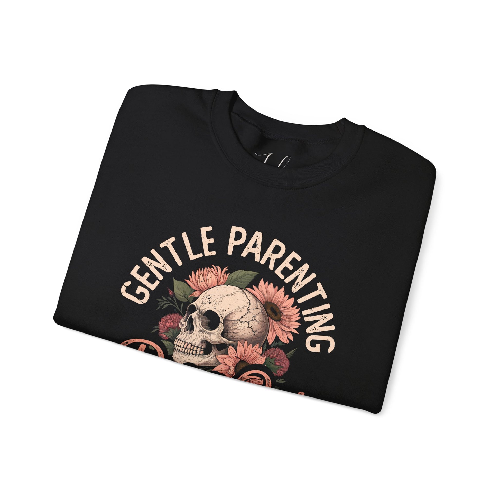 Black folded crewneck featuring floral skull and “Gentle Parenting Drop Out” print.